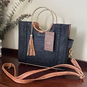 Elegant Genuine leather Black and Tan Handbag with Gold Accents.
